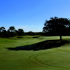 A sunny day view from a fairway at Twisted Oaks Golf Club.