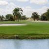 A view of a green with water and bunkers coming into play at Country Club of Coral Springs.