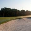 A view of a hole protected by a huge buker at Lone Palm Golf Club.