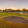 A sunset view of a hole at Wentworth Golf Club.