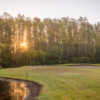 A view of a hole guarded by a tricky bunker at Wentworth Golf Club.