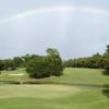 A view of a green and the rainbow over Rocky Bayou Country Club.