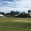 A view of a tee and the clubhouse at Legacy Golf Club.