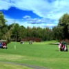 A sunny day view of a hole at Big Cypress Golf & Country Club.