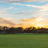 A sunset view of a hole at Heritage Oaks Golf & Country Club.
