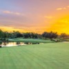 A sunset view of a well protected hole at River Hall Country Club.