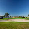 View of a green and bunker at Pinecrest Golf Club.