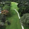Aerial view of the 8th fairway and green at Calusa Lakes Golf Club. 