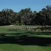 A view from tee of the 4th hole surrounded by water at Sugar Mill Country Club - Blue Course