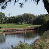 A view over the water of green at Oaks Club