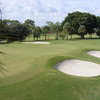 A view of green guarded by bunkers at Tequesta Country Club