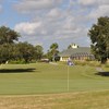 A view of a green with the clubhouse in background at Pennbrooke Fairways