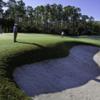 A view of green guarded by bunker from The Club At Mediterra