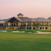 A view of a green and the clubhouse at The Golf Lodge At the Quarry.