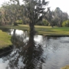 A view over the water of green at Timber Creek Golf Course