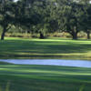 A view of a green surrounded by water at North Shore Golf Course