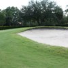 A view 0f a green protected by a bunker at Beacon Woods Golf Club