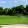 A view of a green protected by tricky bunkers at Seagate Country Club