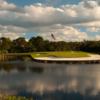 A view of green #9 surrounded by water at Trump National Golf Club.