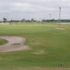 A view of a hole guarded by sand traps at Duffy's Golf Center