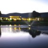 A view over the water of the clubhouse at Palmetto-Pine Country Club