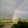 A view of a double rainbow protecting Lago Mar Country Club