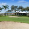 A view of the 9th green and the clubhouse in background at Village Golf Course