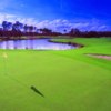 A view of a hole with water in background at Grand Club Pine Lakes Course