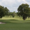 A view of a green flanked by sand traps at Placid Lakes Country Club