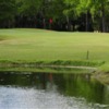 A view over the water of a  green at Colony West Country Club