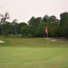 A view of a green and a fairway at Oak Hills Golf Club