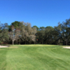 A view of the 1st green flanked by bunkers at Heather Golf & Country Club