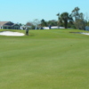 A view of the 1st green protected by bunkers at Barefoot Bay Golf & Recreation Park