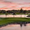 A view of a green surrounded by water from Flamingo Island Course at Lely Resort Golf & Country Club