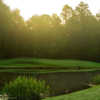 A view of a green surrounded by water at Tampa Palms Golf & Country Club