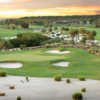 A view of a green protected by sand traps at Talon Course from TwinEagles Golf & Country Club