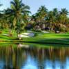 A view of a hole with water and bunkers into play at Boca West Country Club