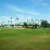 A view of a hole flanked by bunkers and the clubhouse in background at Pasadena Yacht & Country Club