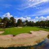 A view of a green with water and sand traps coming into play at Bradenton Country Club