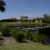 A view of the clubhouse and practice putting green at Crown Colony Golf & Country Club