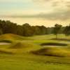 A view of a hole surrounded by a collection of tricky sand traps at Golden Ocala Golf & Equestrian Club