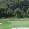 A view of a green protected by tricky bunkers at Tarpon Springs Golf Course