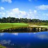 A view of the 5th green with water in foreground at Bonita Bay East - Cypress Course