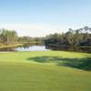 A view of the 2nd green with water in background at Bonita Bay East - Sabal Course