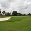 A view of the 8th green protected by bunkers at Cypress Creek Country Club