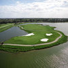 Aerial view of green #3 surrounded by water at Legacy Golf Club