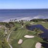 Aerial view of green protected by bunkers at Cove Cay Country Club