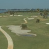 A view of a fairway with water in background at Cocoa Beach Country Club