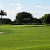 A view of the 10th green, angled from left to right with bunkers on both sides at Heron Bay Golf Course