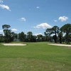A view of green #13 protected by bunkers at Poinciana Country Club